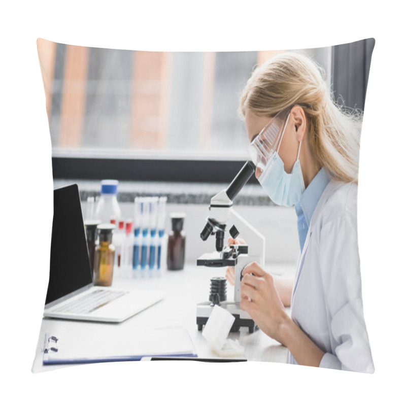 Personality  Scientist In Medical Mask And Goggles Looking Through Microscope Near Gadgets With Blank Screen  Pillow Covers