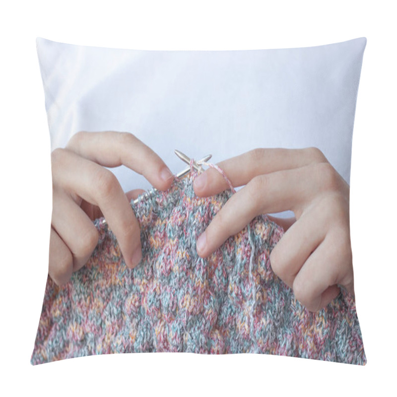 Personality  Two Hands On A White Background Hold Knitting Needles And Knitting Close-up . The Concept Of Hand Made, Home, Hobbies. Pillow Covers