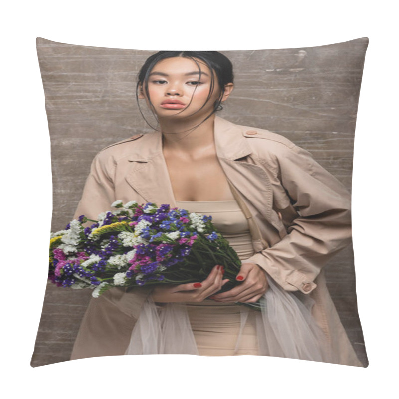 Personality  Fashionable Asian Woman In Trench Coat Holding Wildflowers On Abstract Brown Background  Pillow Covers