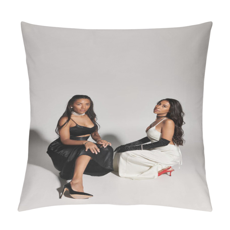 Personality  Two Fashionable Young Women Showcase Their Style While Seated In A Modern Studio Environment. Pillow Covers