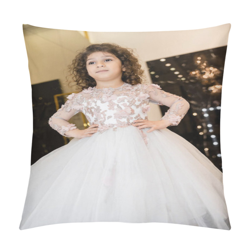 Personality  Low Angle View Of Middle Eastern Little Girl In Floral Dress With Tulle Skirt Standing With Hands On Hips And Looking Away In Bridal Boutique, Preparation For Wedding, Blurred Background  Pillow Covers