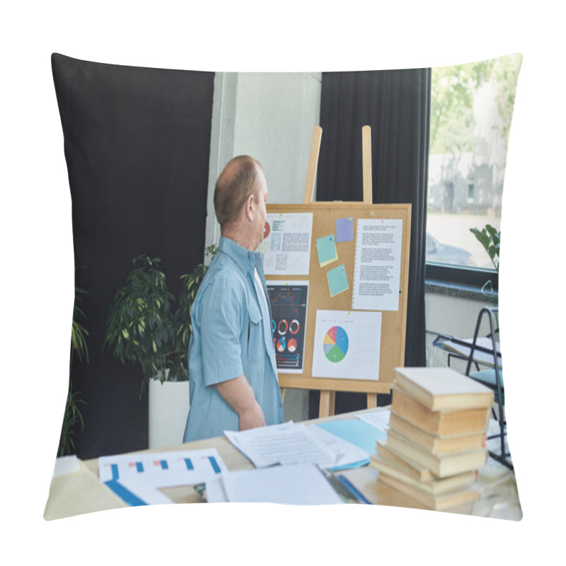 Personality  A Man With Inclusivity In A Blue Shirt Stands Near A Bulletin Board, Reviewing Charts And Data. Pillow Covers