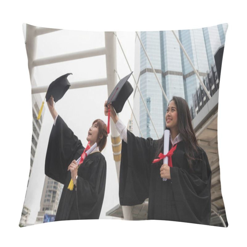 Personality  Asian Beautiful Graduated Female Students With Black Graduation Gowns Hold Diploma And Raise Cap Hats With Modern Bangkok City Background. Happy And Graceful Feeling In Commencement Day. Pillow Covers