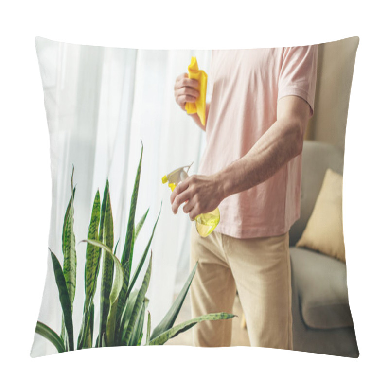 Personality  Handsome Man In Cozy Homewear Delicately Cleaning Houseplant With Yellow Sponge. Pillow Covers