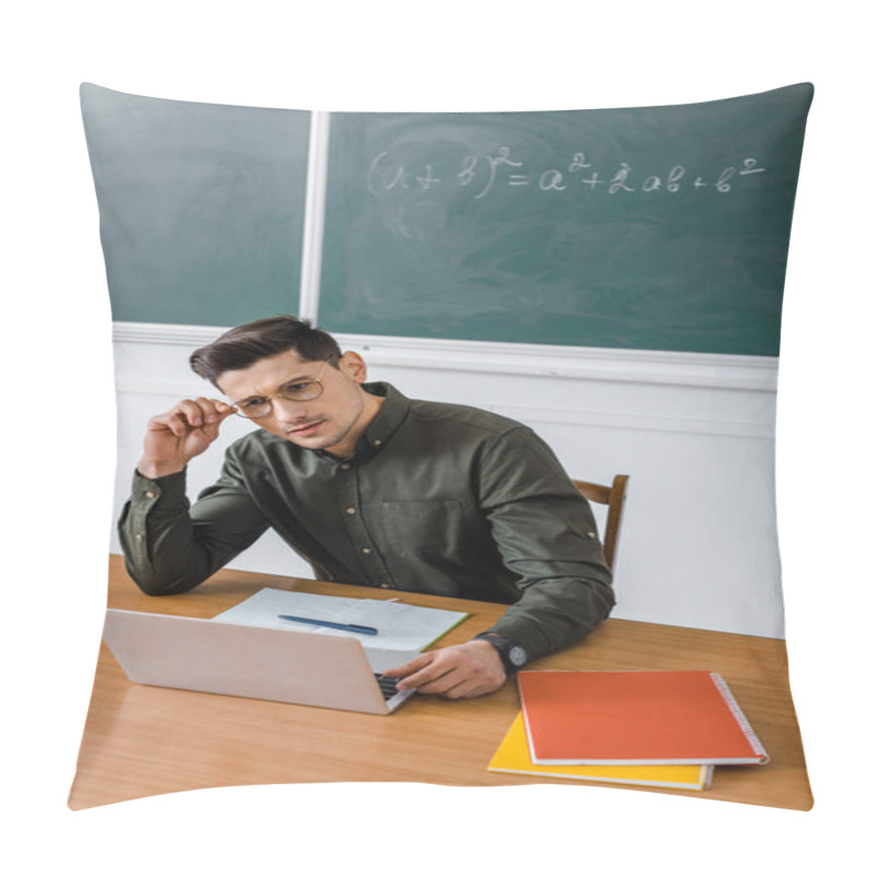 Personality  Pensive Male Teacher In Glasses Sitting And Using Laptop At Desk In Classroom Pillow Covers