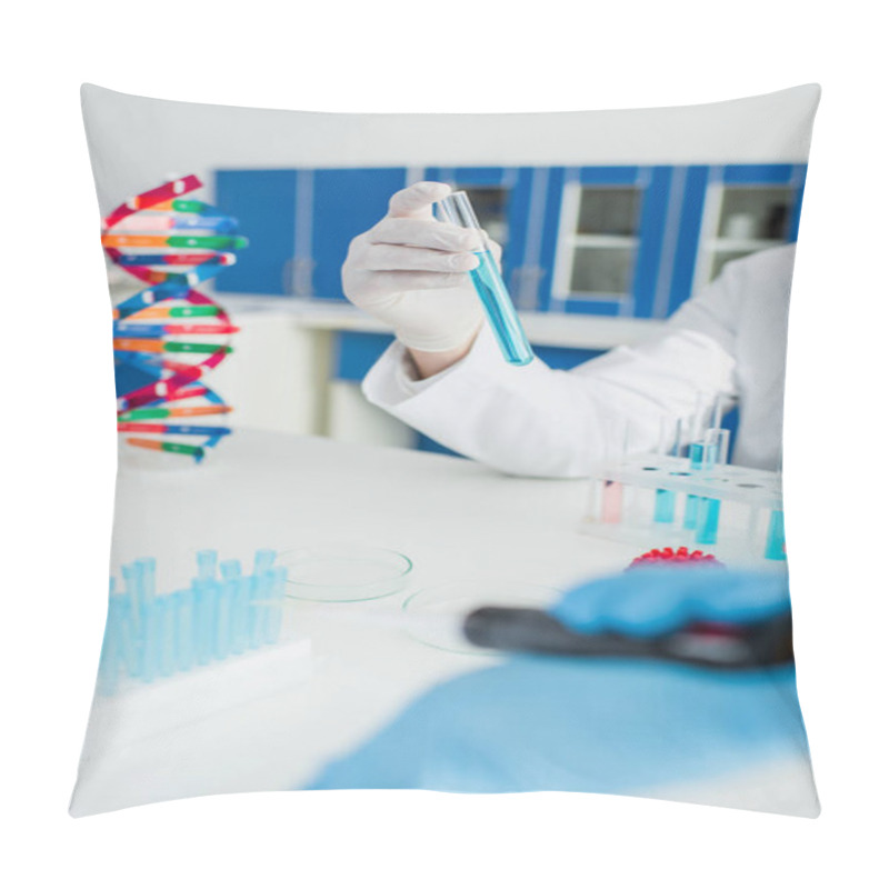 Personality  Partial View Of Scientist Holding Test Tube Near Dna Model On Blurred Foreground Pillow Covers