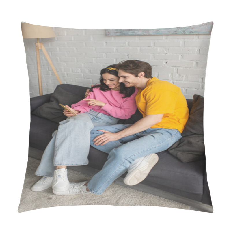 Personality  Smiling Young Woman Pointing With Finger At Cellphone Near Boyfriend On Couch In Living Room Pillow Covers