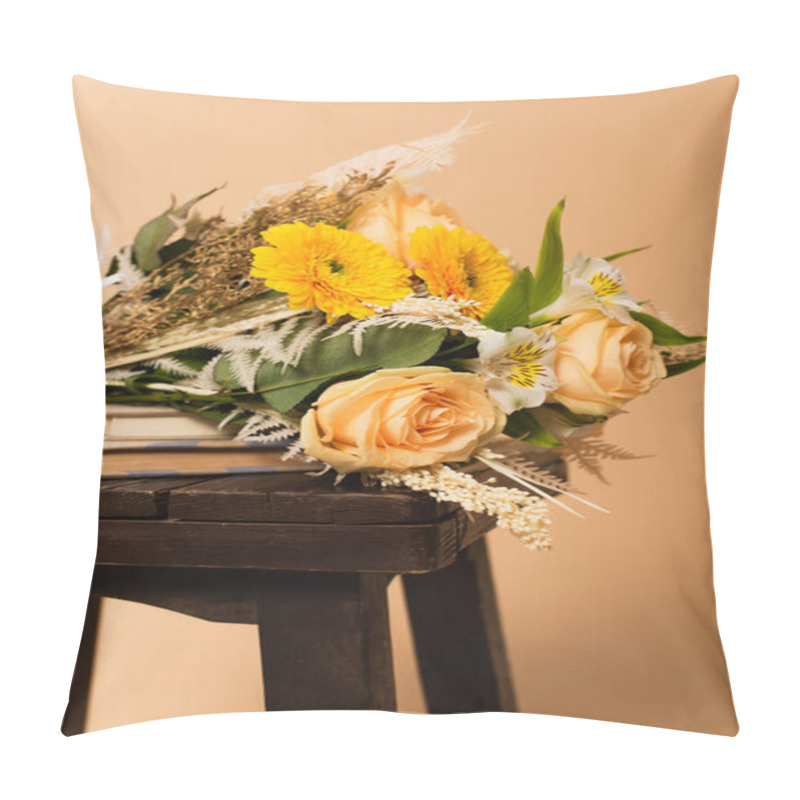 Personality  Bouquet Of Different Flowers On Books And Wooden Chair Isolated On Beige  Pillow Covers