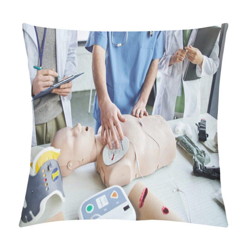 Personality  Cropped View Of Instructor Applying Defibrillator Pads On CPR Manikin Near Medical Equipment And Young Students In White Coats During First Aid Seminar, Life-saving Skills Hands-on Learning Concept Pillow Covers