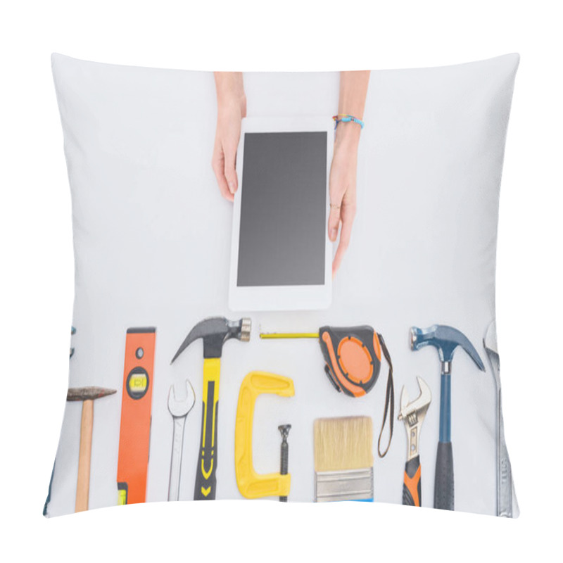 Personality  Cropped Shot Of Woman Using Tablet With Various Tools Lying On White Pillow Covers