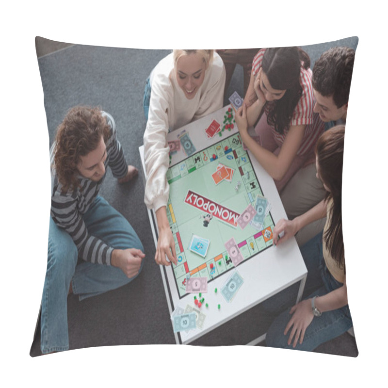 Personality  KYIV, UKRAINE - JANUARY 27, 2020: Overhead View Of Smiling Friends Sitting On Floor And Playing Monopoly Game Pillow Covers