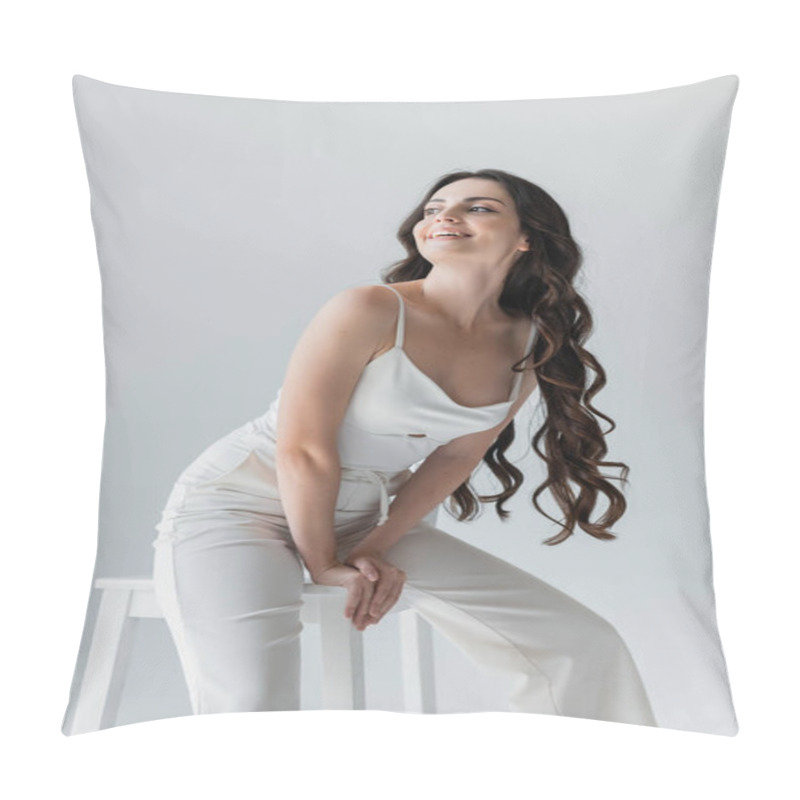 Personality  Positive Long Haired Model Sitting On Chair And Looking Away Isolated On Grey  Pillow Covers