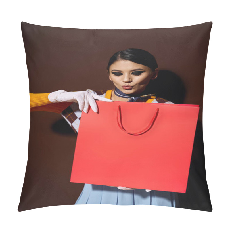 Personality  A Young Woman In A Stylish Outfit Holds A Red Shopping Bag, Looking Excited About The Contents. Pillow Covers