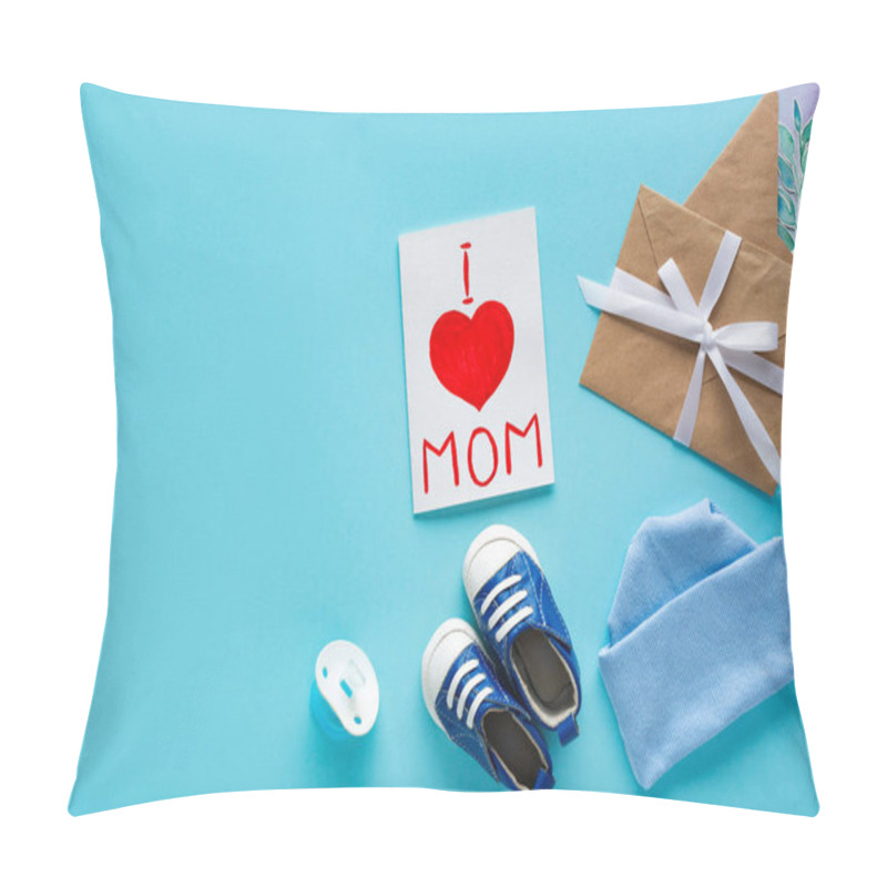 Personality  Top View Of I Love Mom Lettering On Greeting Card Near Baby Hat, Pacifier And Booties On Blue Background Pillow Covers