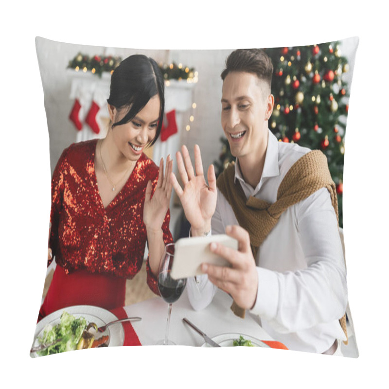 Personality  Pregnant Asian Woman With Smiling Husband Waving Hands During Video Call On Smartphone At Christmas Celebration Pillow Covers