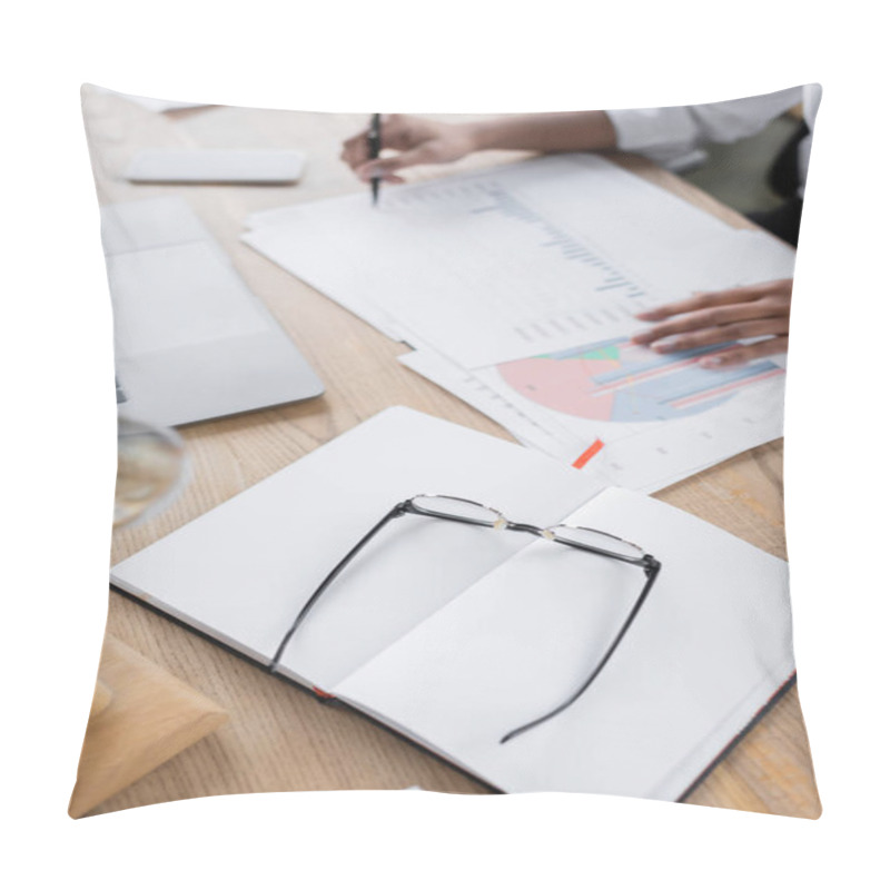 Personality  High Angle View Of Eyeglasses And Blank Notebook Near Cropped African American Businesswoman Working With Infographics In Office Pillow Covers