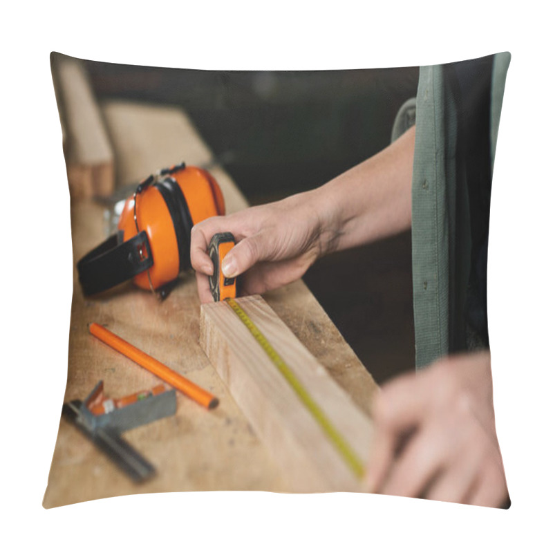 Personality  A Skilled Carpenter Carefully Measures Wood With A Tape Measure In A Workshop Filled With Tools And Creativity. Pillow Covers