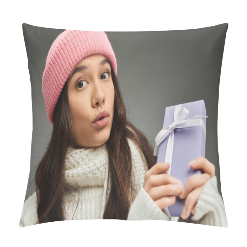 Personality  Excitement Fills The Air As A Young Woman Models Her Trendy Look With A Thoughtful Gift In Hand. Pillow Covers