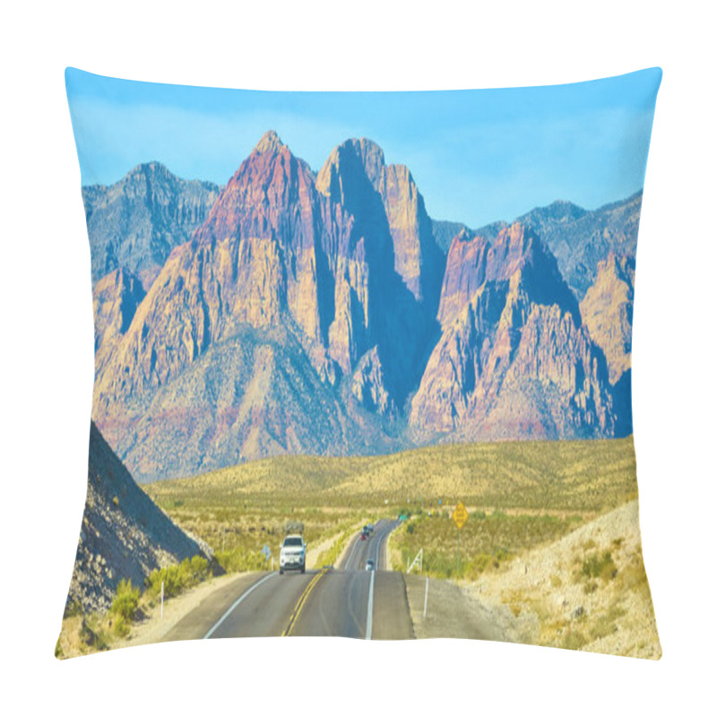 Personality  Journey Through The Breathtaking Red Rock Canyon Near Las Vegas. The Winding Road Invites Adventure Against A Backdrop Of Vibrant Rock Formations And A Clear Blue Sky. Perfect For Travel And Tourism Pillow Covers