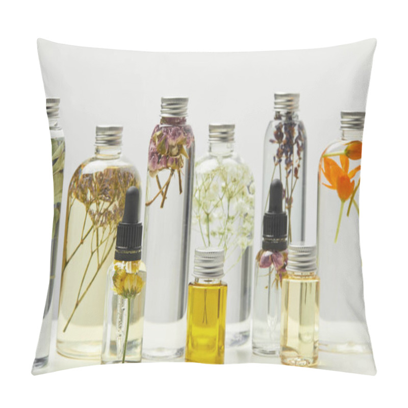 Personality  Different Organic Beauty Products In Bottles With Herbs And Flowers Isolated On Grey  Pillow Covers