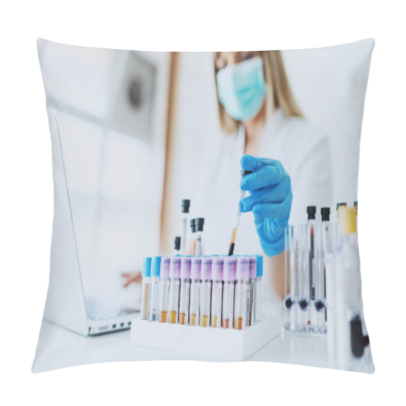 Personality  Close Up Of Lab Assistant In Uniform, With Mask And Rubber Gloves Holding Test Tube With Blood Sample While Sitting On Chair And Typing On Laptop. Selective Focus On Test Tubes. Pillow Covers