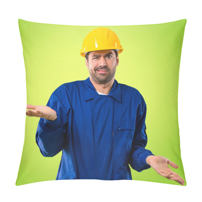 Personality  Young Workman With Helmet Unhappy And Frustrated With Something Because Not Understand Something. Negative Facial Expression On Green Background Pillow Covers