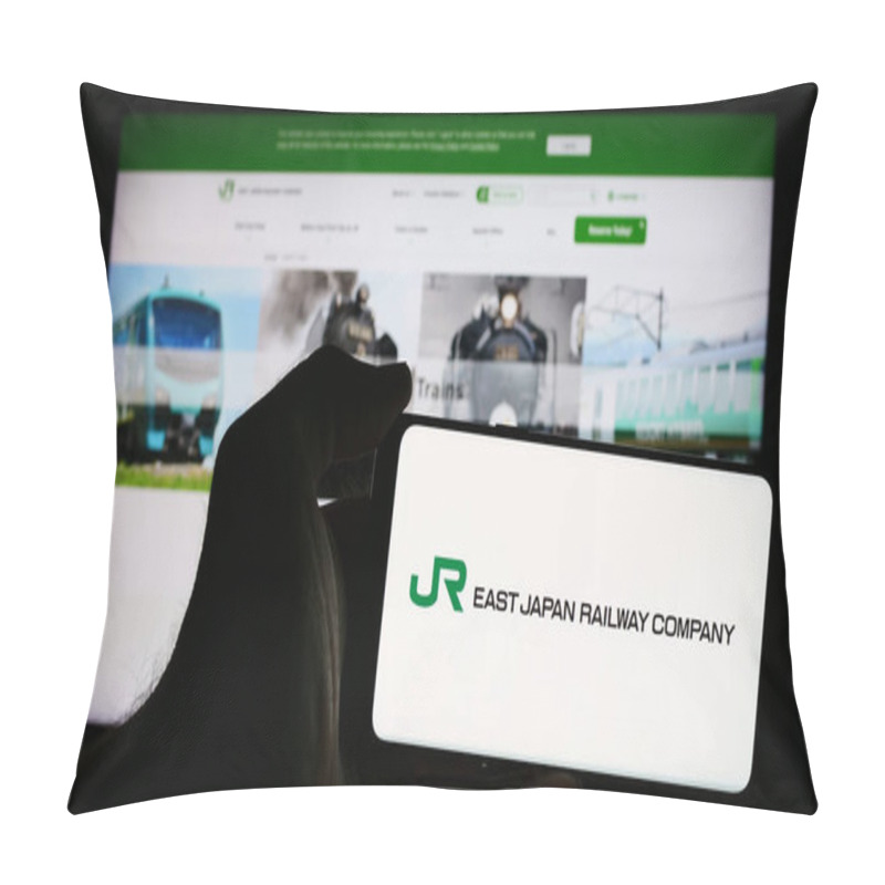 Personality  Stuttgart, Germany - 07-23-2024: Person Holding Mobile Phone With Logo Of Japanese Railroad Business East Japan Railway Company In Front Of Web Page. Focus On Phone Display. Pillow Covers