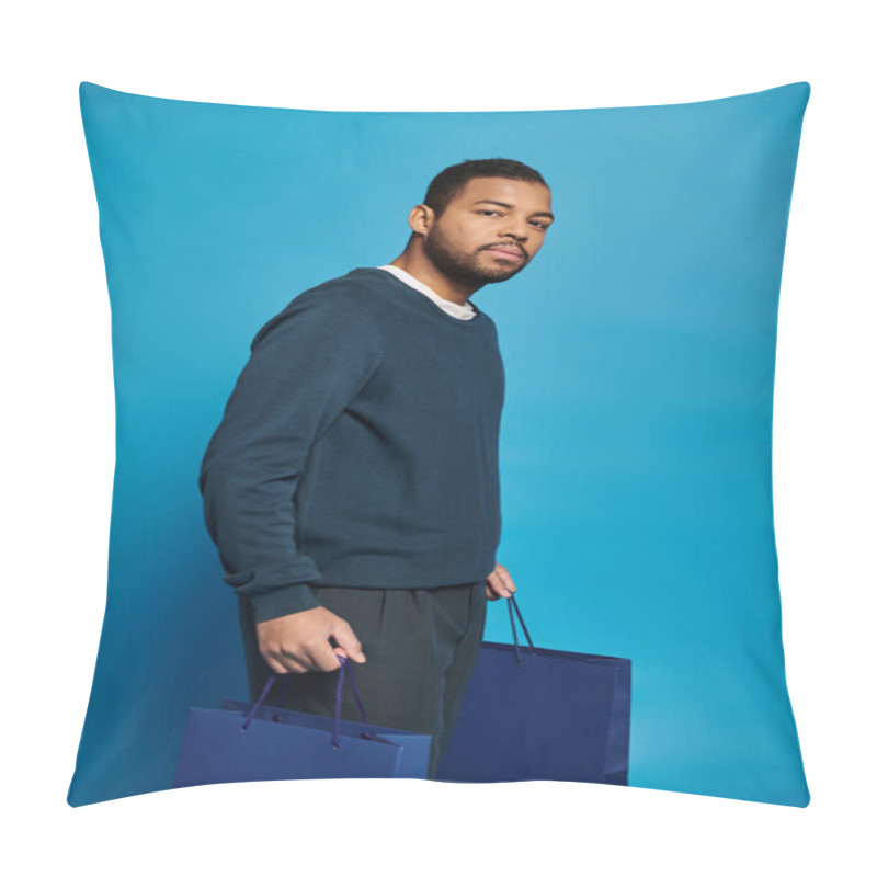 Personality  Charming African American Man In 20s Standing Sideways With Shopping Bag In Hands On Blue Background Pillow Covers