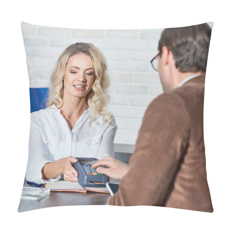 Personality  Smiling Female Seller Holding Payment Terminal And Customer Entering Pin Code In Shop Pillow Covers