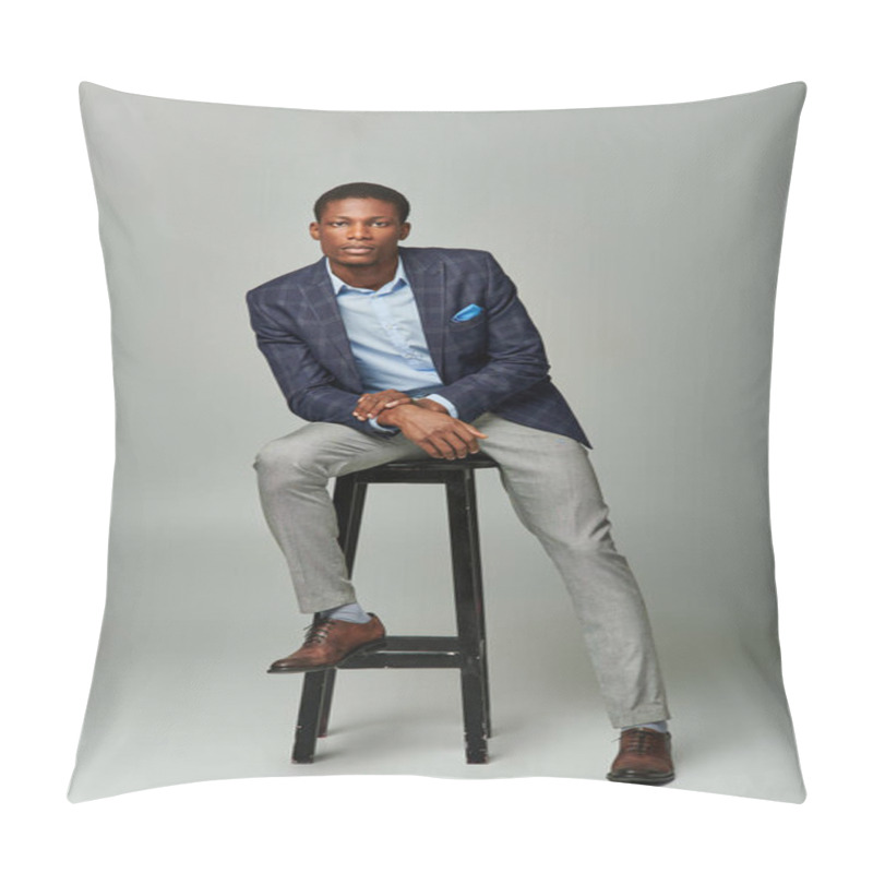 Personality  Handsome Young Businessman In Checkered Blazer, Sitting Confidently On Stool Against Grey Backdrop. Pillow Covers