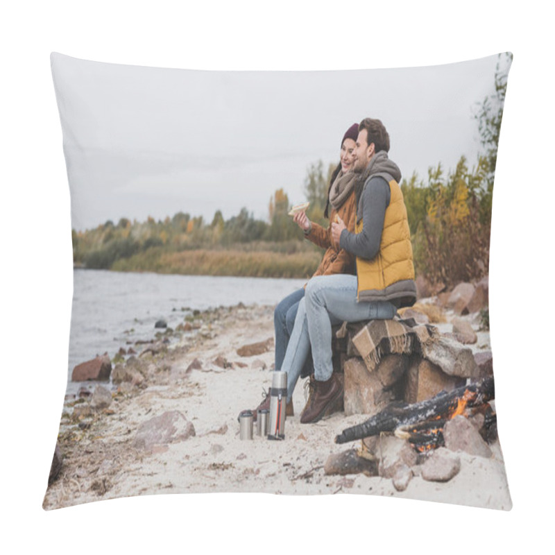 Personality  Happy Couple In Autumn Clothes Looking At River While Sitting With Sandwiches Pillow Covers