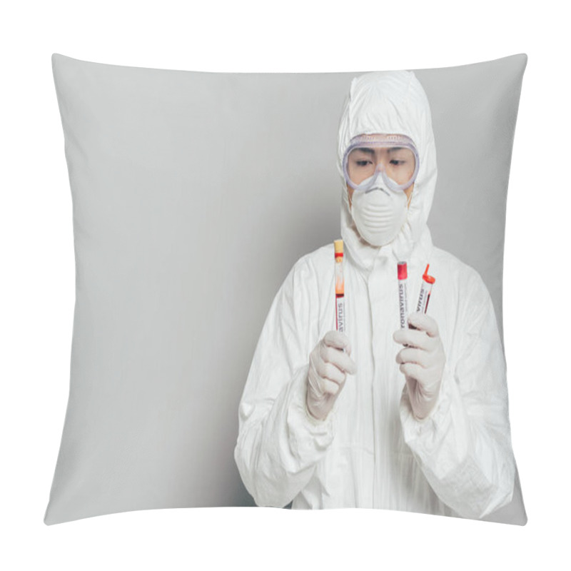 Personality  Asian Epidemiologist In Hazmat Suit And Respirator Mask Holding Test Tubes With Blood Samples On Grey Background Pillow Covers