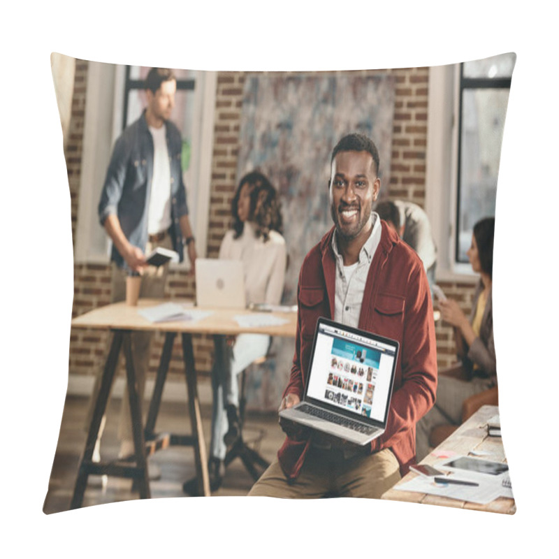 Personality  African American Casual Businessman Holding Laptop With Shopping Web Site And Colleagues Working Behind In Loft Office Pillow Covers