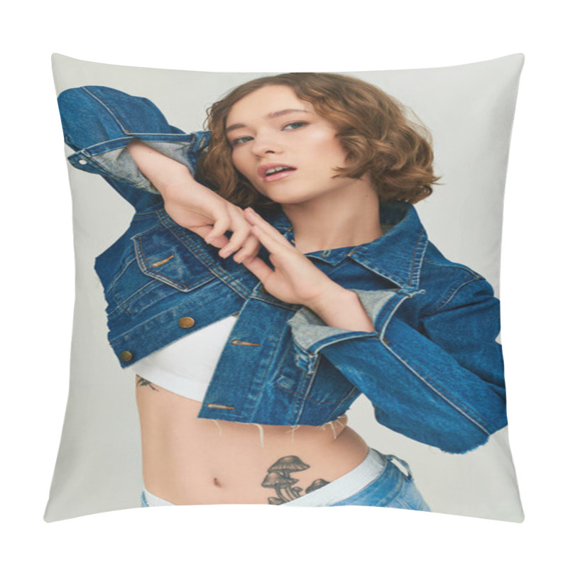 Personality  Fashionable Girl With Tattoo Posing In Cropped Denim Jacket And Blue Jeans On Grey Background Pillow Covers