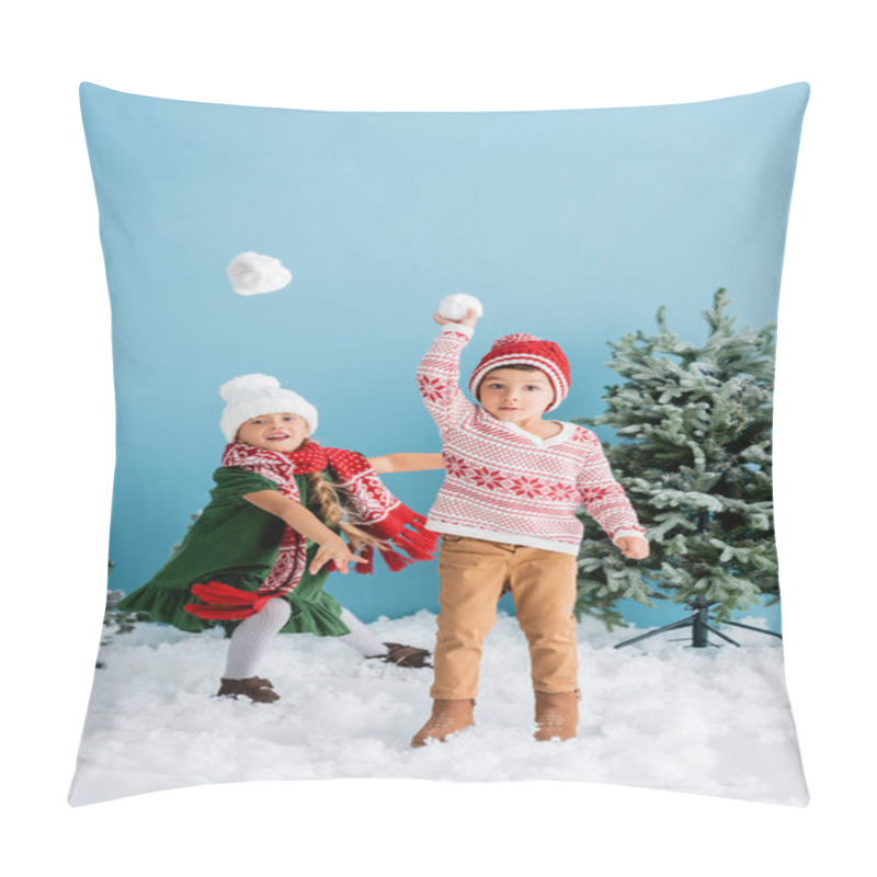 Personality  Children In Winter Outfit Playing Snowballs Near Christmas Trees On Blue Pillow Covers