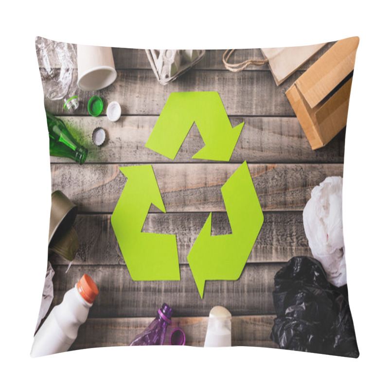 Personality  Top View Of Different Garbage Materials With Recycling Symbol On Table Background. Recycle, Environment And Eco Concept Pillow Covers