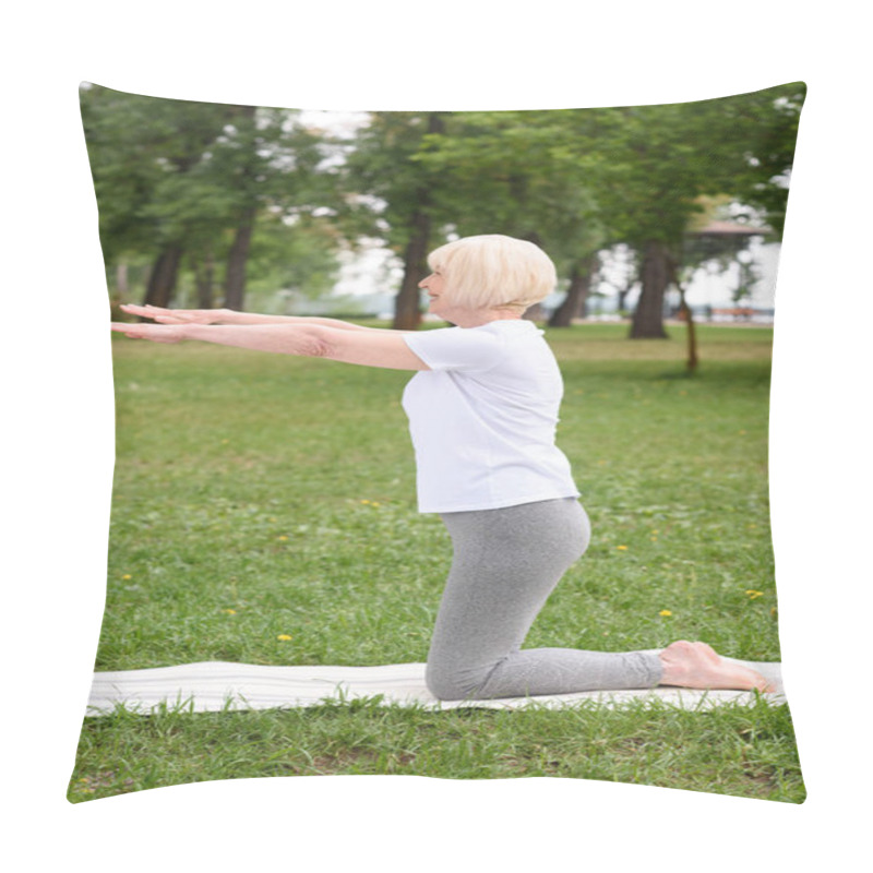 Personality  Senior Woman Practicing Yoga On Mat On Green Lawn In Park Pillow Covers