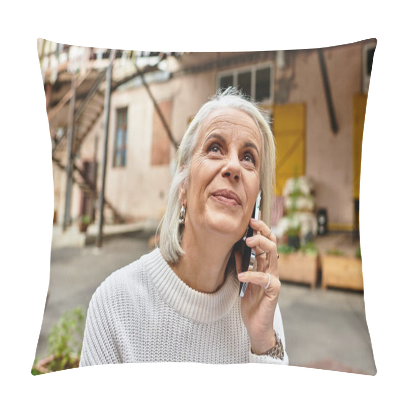 Personality  A Mature Woman With Elegant Gray Hair Enjoys A Phone Conversation In A Vibrant Outdoor Space. Pillow Covers