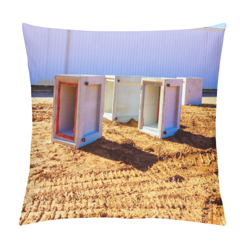 Personality  Concrete Drainage Boxes Are Arranged On Dirt Surface At Construction Site, Showcasing Industrial Materials. Pillow Covers