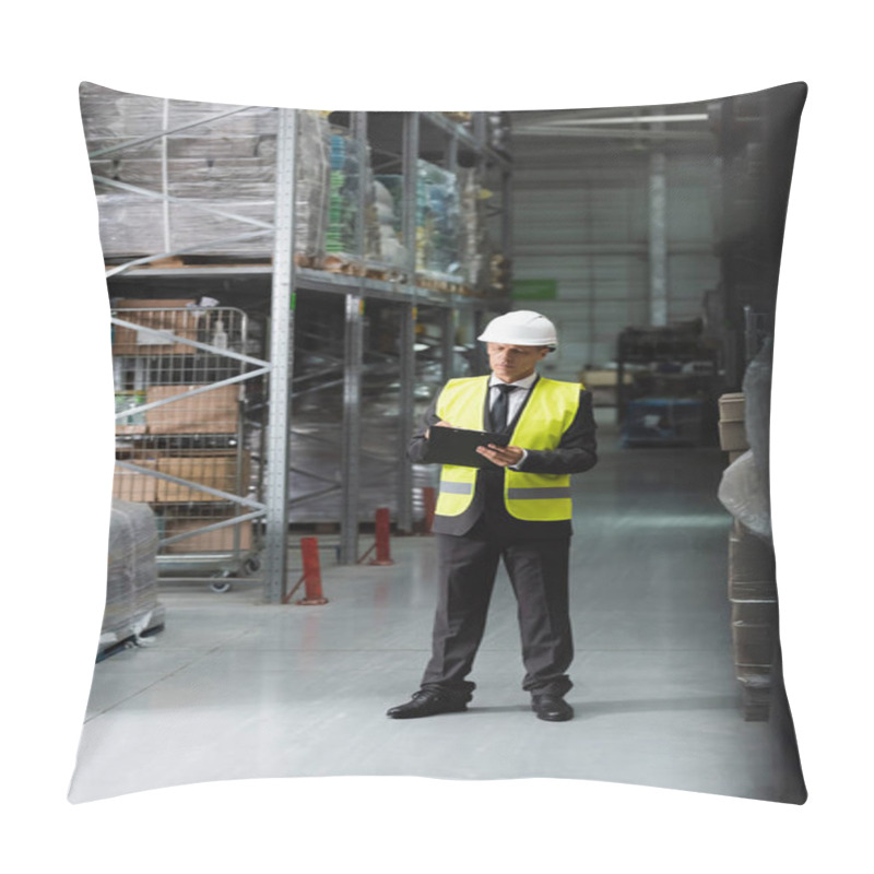 Personality  Confident Middle Aged Supervisor In Safety Vest And Hard Hat Writing On Clipboard In Warehouse Pillow Covers