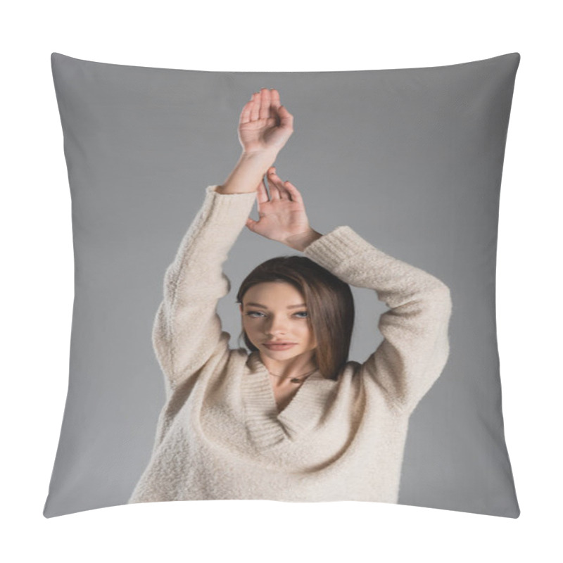 Personality  Sensual Woman In Warm Sweater Standing With Raised Hands And Looking At Camera Isolated On Grey Pillow Covers