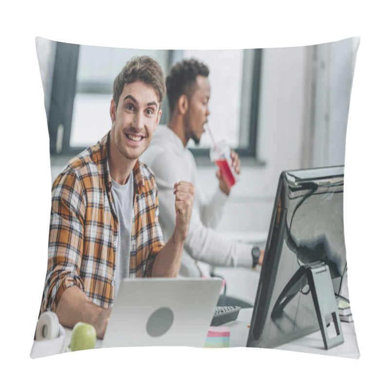 Personality  Happy Programmer Looking At Camera And Showing Winner Gesture While Sitting Near African American Colleague Pillow Covers