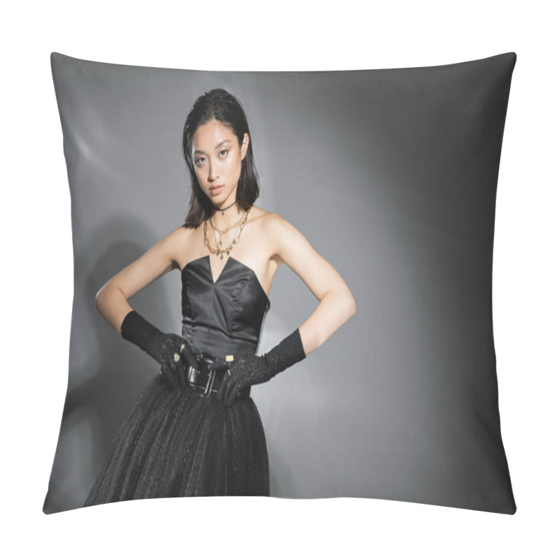 Personality  Charming Asian Young Woman With Short Hair Posing In Black Strapless Dress With Tulle Skirt Touching Belt And Looking At Camera On Grey Background, Wet Hairstyle, Golden Jewelry  Pillow Covers