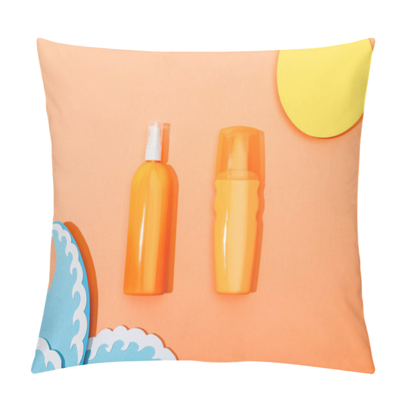 Personality  Top View Of Dispenser Bottles Of Sunscreen With Paper Cut Sun And Sea Waves On Orange Background Pillow Covers