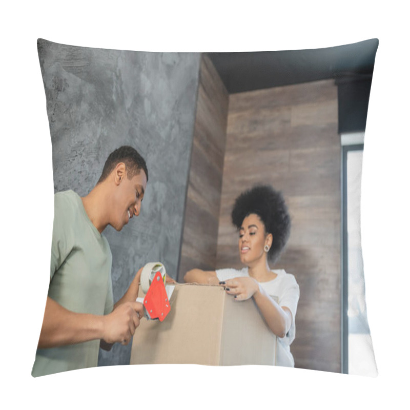 Personality  Smiling African American Man Holding Adhesive Tape Near Cardboard Boxes And Girlfriend During Moving Pillow Covers