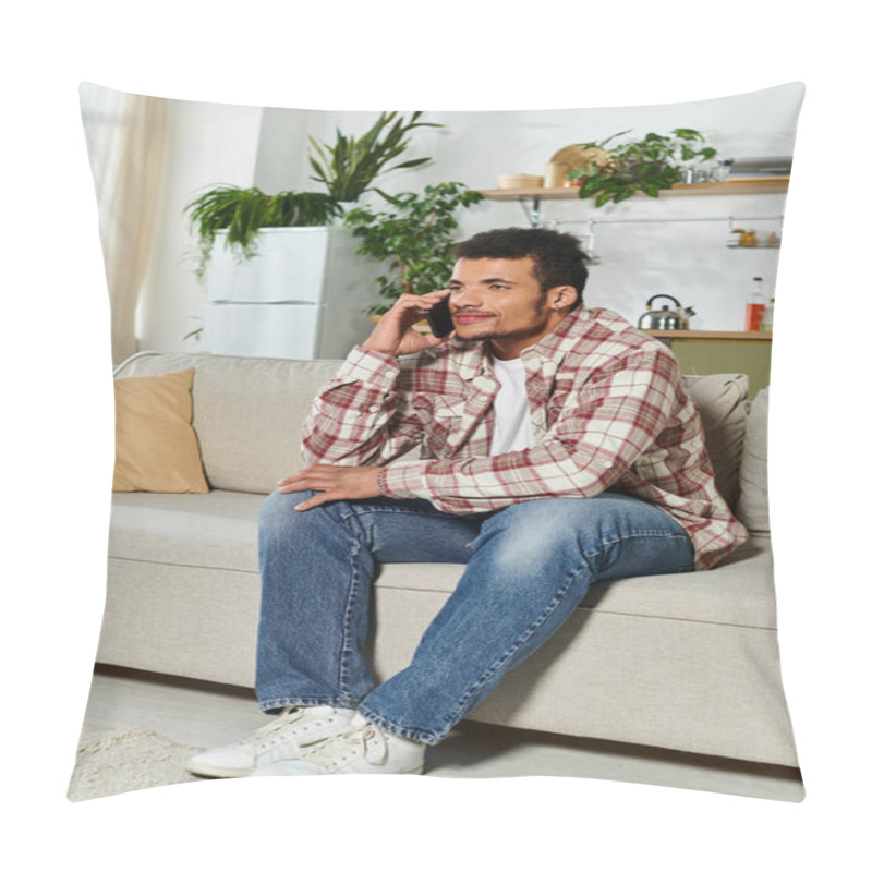 Personality  A Young Handsome Man Sits Comfortably On A Sofa, Engaged In A Phone Conversation In A Bright Room. Pillow Covers