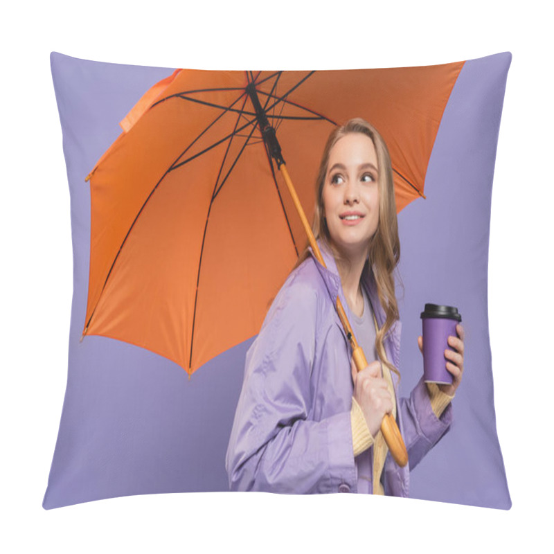 Personality  Cheerful Young Woman In Trench Coat Holding Paper Cup And Standing Under Orange Umbrella Isolated On Purple  Pillow Covers