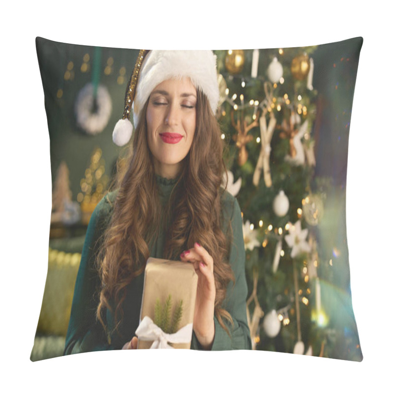 Personality  Christmas Time. Happy Stylish 40 Years Old Housewife With Santa Hat And Eco Packaged Present Box In Green Dress Near Christmas Tree At Modern Home. Pillow Covers