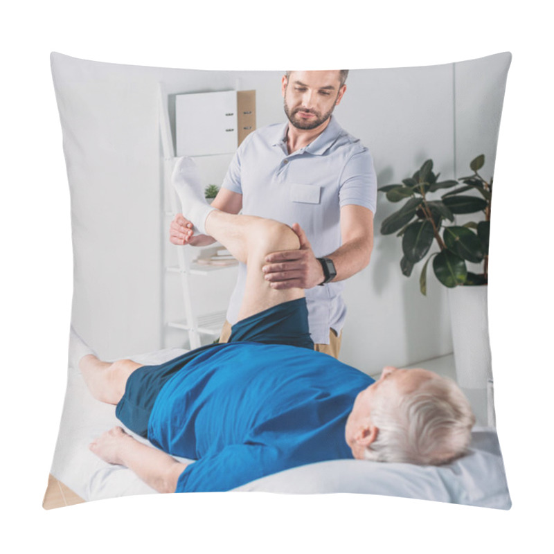 Personality  Focused Rehabilitation Therapist Massaging Senior Mans Leg On Massage Table Pillow Covers