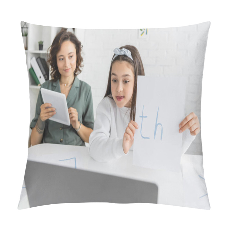 Personality  Preteen Child Holding Paper With Letters Near Laptop And Mom During Online Speech Therapy At Home  Pillow Covers